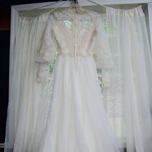 Vintage Victorian era handmade wedding dress with intricate lace detail and trim